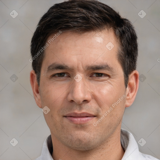 Joyful white adult male with short  brown hair and brown eyes