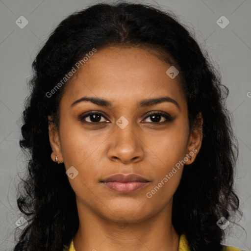 Joyful black young-adult female with long  brown hair and brown eyes