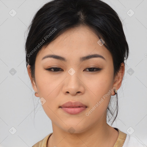 Joyful asian young-adult female with medium  black hair and brown eyes