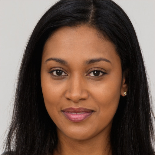 Joyful asian young-adult female with long  black hair and brown eyes
