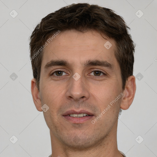 Joyful white young-adult male with short  brown hair and brown eyes