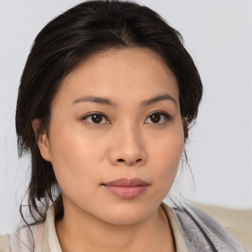 Neutral asian young-adult female with medium  brown hair and brown eyes