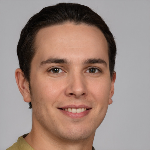 Joyful white young-adult male with short  brown hair and brown eyes