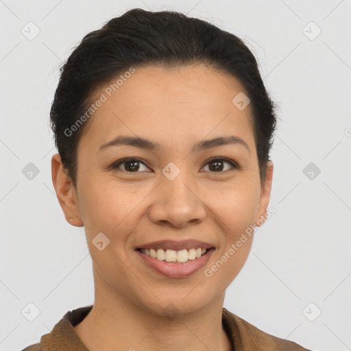 Joyful latino young-adult female with short  brown hair and brown eyes