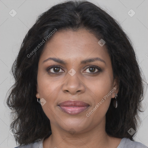 Joyful black adult female with medium  brown hair and brown eyes