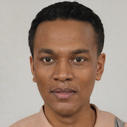 Neutral black adult male with short  black hair and brown eyes