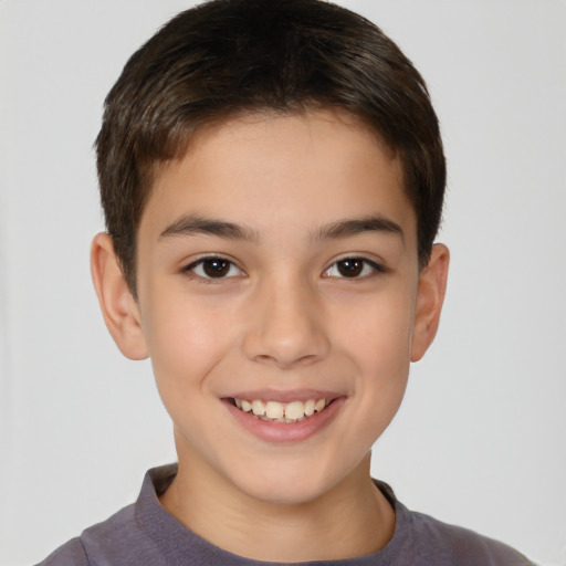 Joyful white child male with short  brown hair and brown eyes