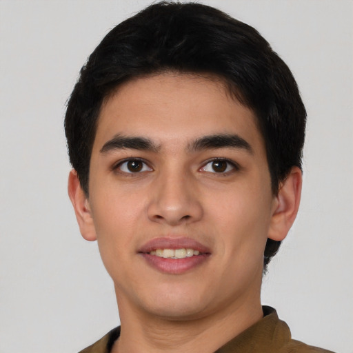 Joyful asian young-adult male with short  black hair and brown eyes