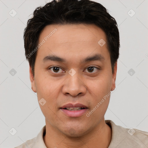 Joyful white young-adult male with short  black hair and brown eyes