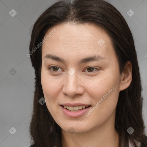 Joyful white young-adult female with long  brown hair and brown eyes