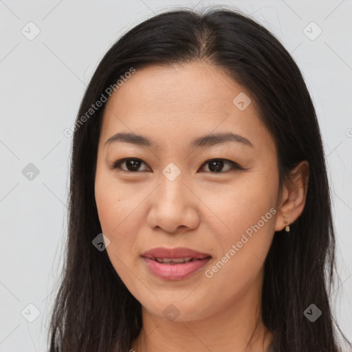 Joyful asian young-adult female with long  brown hair and brown eyes