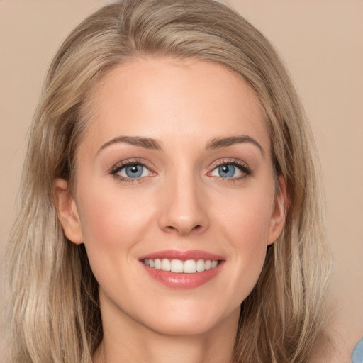 Joyful white young-adult female with long  brown hair and blue eyes