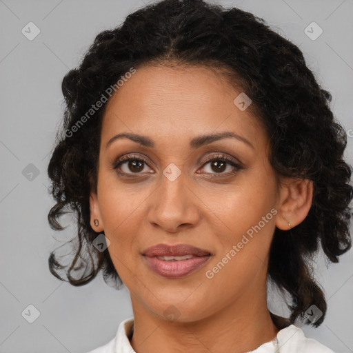 Joyful latino adult female with medium  brown hair and brown eyes