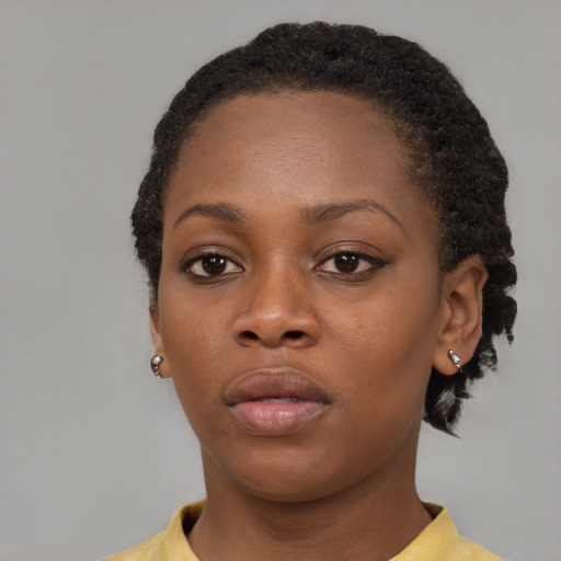 Neutral black young-adult female with short  brown hair and brown eyes