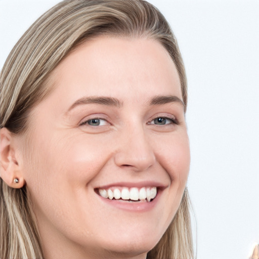 Joyful white young-adult female with long  brown hair and blue eyes