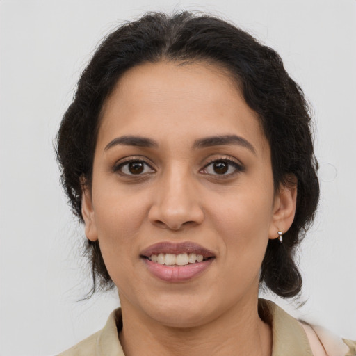 Joyful latino young-adult female with medium  brown hair and brown eyes