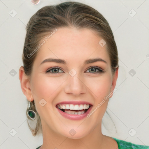 Joyful white young-adult female with medium  brown hair and green eyes