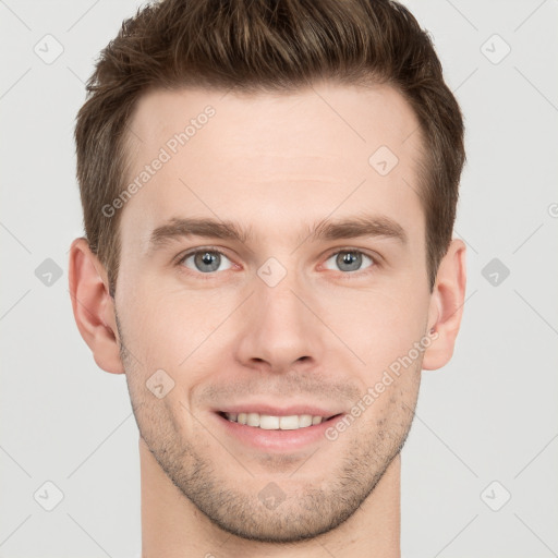 Joyful white young-adult male with short  brown hair and grey eyes