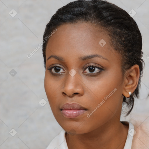 Neutral black young-adult female with short  brown hair and brown eyes