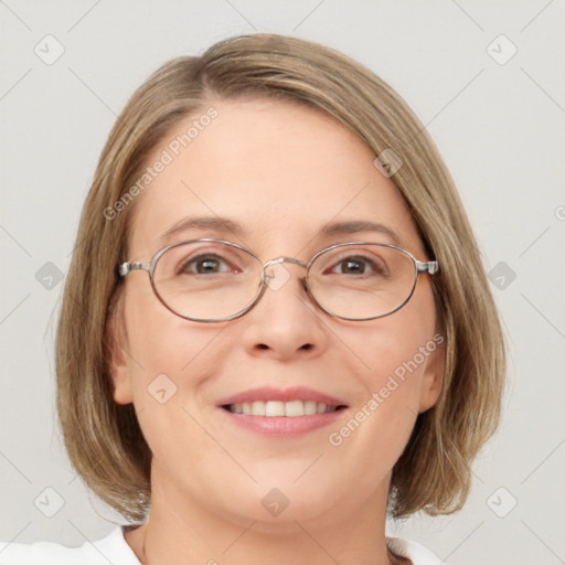 Joyful white adult female with medium  brown hair and blue eyes