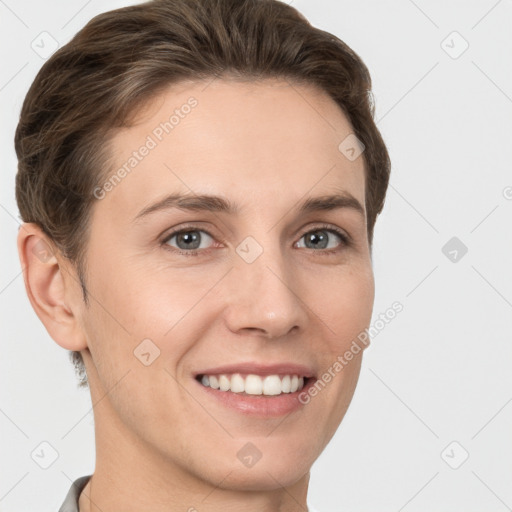 Joyful white young-adult female with short  brown hair and grey eyes