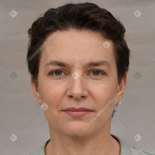 Joyful white adult female with short  brown hair and brown eyes