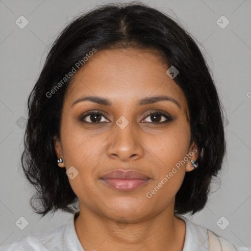 Joyful black young-adult female with medium  brown hair and brown eyes