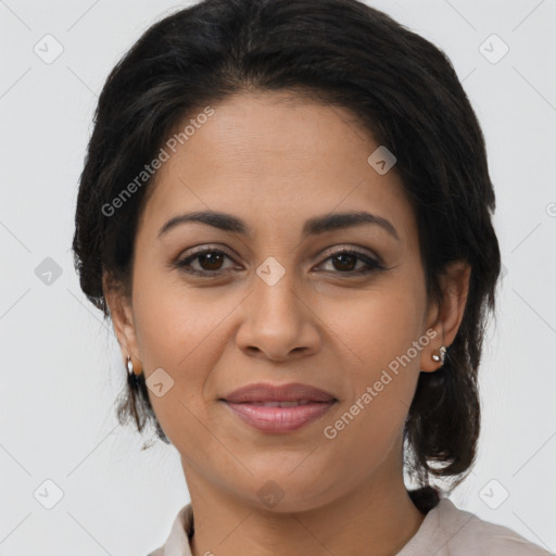 Joyful latino young-adult female with medium  brown hair and brown eyes