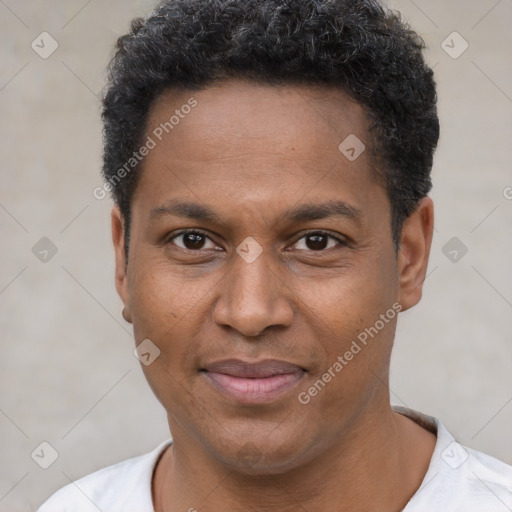 Joyful latino young-adult male with short  brown hair and brown eyes