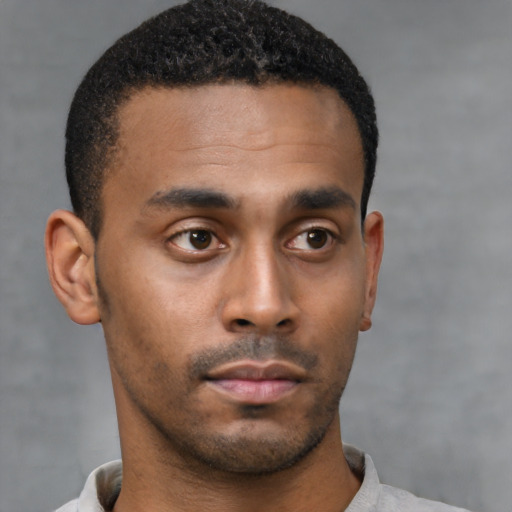 Neutral black young-adult male with short  black hair and brown eyes