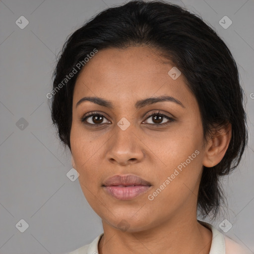 Joyful latino young-adult female with medium  black hair and brown eyes