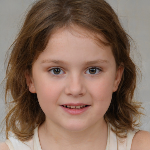 Joyful white child female with medium  brown hair and brown eyes