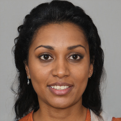 Joyful latino young-adult female with medium  black hair and brown eyes