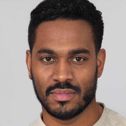 Neutral black young-adult male with short  black hair and brown eyes