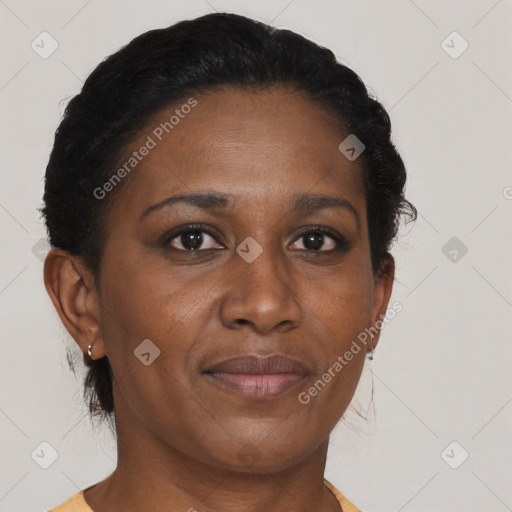 Joyful black adult female with short  brown hair and brown eyes