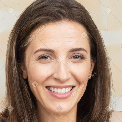 Joyful white adult female with long  brown hair and brown eyes