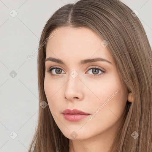 Neutral white young-adult female with long  brown hair and brown eyes