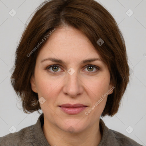 Joyful white adult female with medium  brown hair and grey eyes