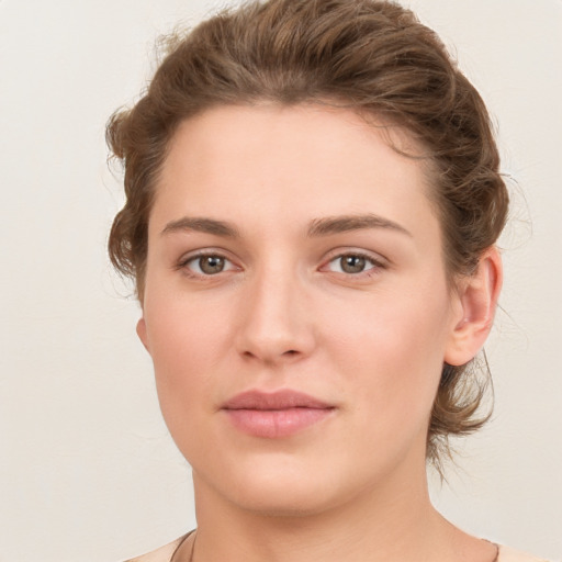 Neutral white young-adult female with short  brown hair and brown eyes