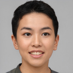 Joyful asian young-adult female with short  black hair and brown eyes