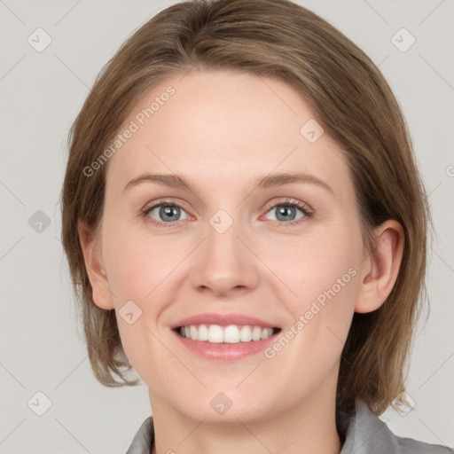 Joyful white young-adult female with medium  brown hair and blue eyes