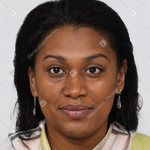 Joyful black adult female with medium  brown hair and brown eyes