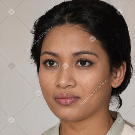 Joyful latino young-adult female with medium  black hair and brown eyes