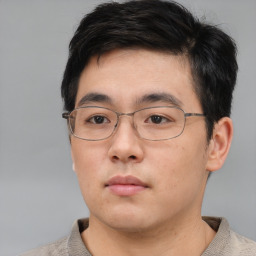 Neutral asian young-adult male with short  brown hair and brown eyes