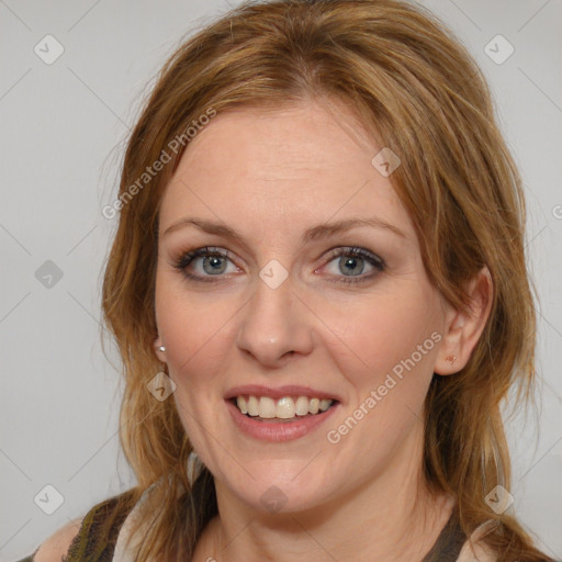 Joyful white young-adult female with medium  brown hair and blue eyes