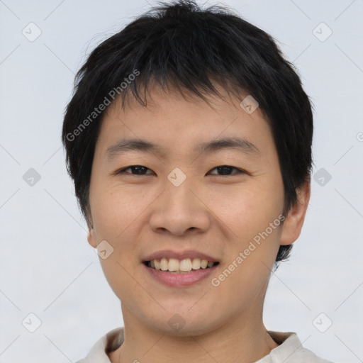 Joyful asian young-adult male with short  black hair and brown eyes