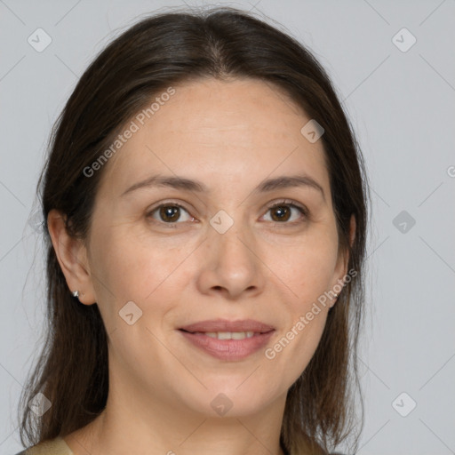 Joyful white adult female with medium  brown hair and brown eyes