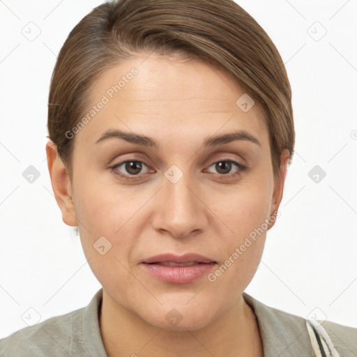 Joyful white young-adult female with short  brown hair and grey eyes