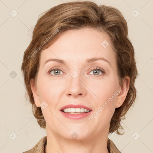 Joyful white adult female with medium  brown hair and blue eyes