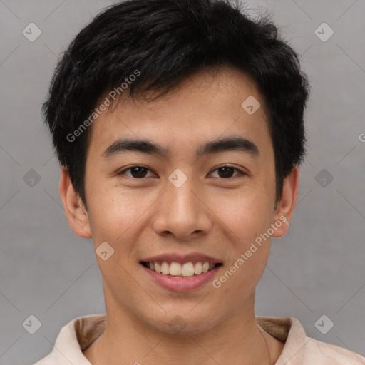 Joyful asian young-adult male with short  black hair and brown eyes